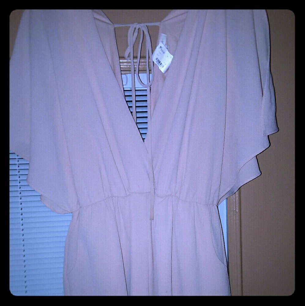 NWT Romper...pale peach/pink in color.